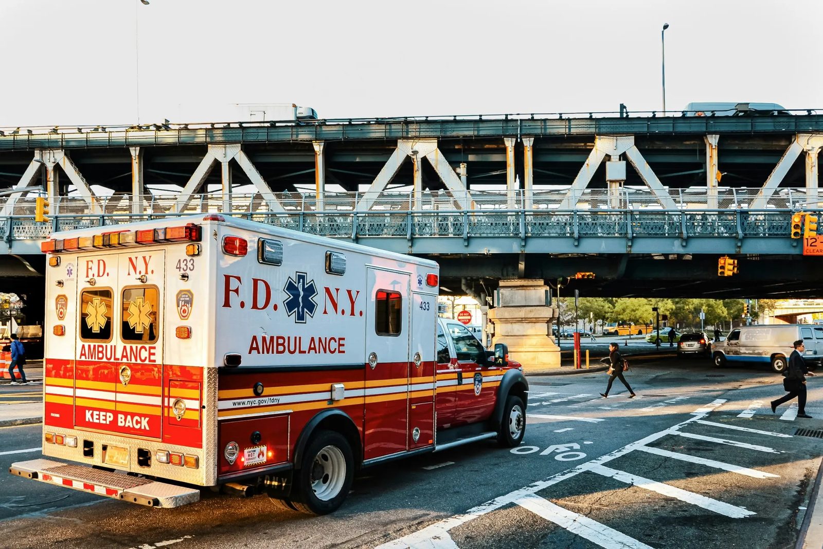 An ambulance waiting at a city intersection